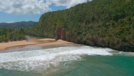 Rio-San-Juan-enters-Caribbean-sea,-aerial-view,-El-Valle,-Samana