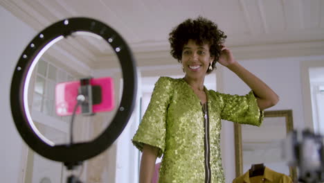 Pretty-short-haired-Black-woman-recording-video-with-smartphone