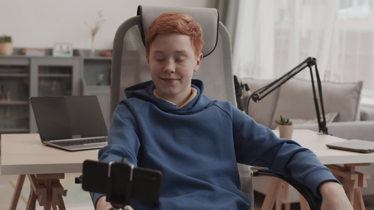 Teenage boy vlogging in his room