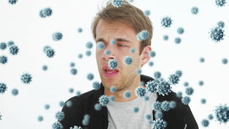 animazione delle cellule del coronavirus covid19 che si diffondono sull'uomo caucasico che si soffia il naso