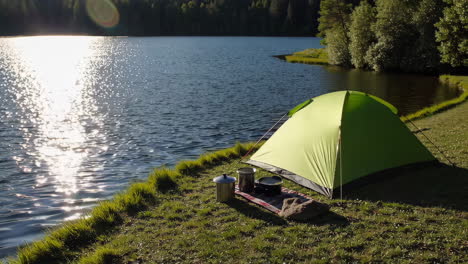 camping by the lake at sunrise