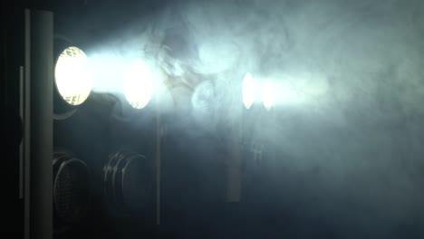 stage lights , floodlights shining brightly and turning on and off