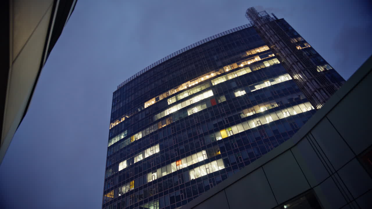 Night building glass exterior low angle. Urban architecture n evening downtown
