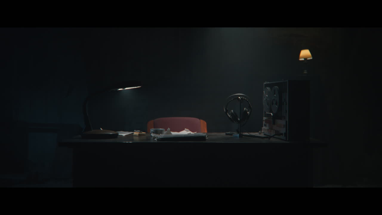 An intelligence officer sits down to the wiretap station