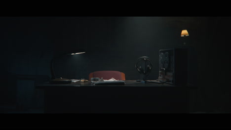 an intelligence officer sits down to the wiretap station