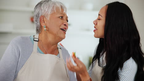 happy woman, daughter and tasting while cooking