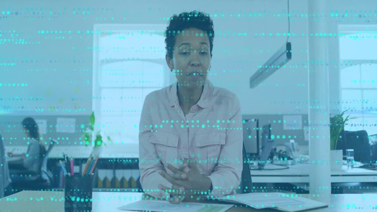 Animation of data processing over african american businesswoman talking in office