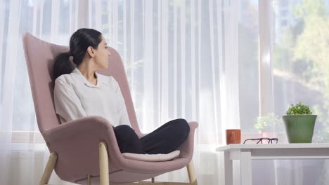 Peaceful-woman-at-home-sitting-by-the-window.