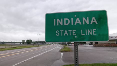 indiana state line sign on the state line with michigan with gimbal video panning left to right