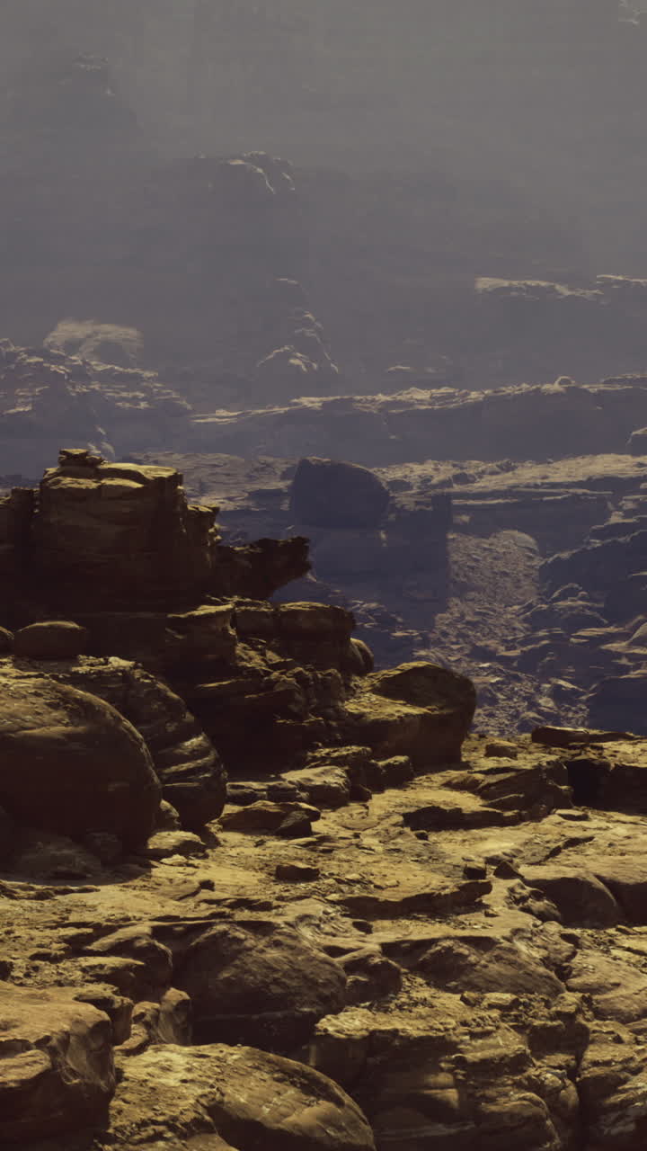 Desert landscape showcasing rugged terrain and distant mountains at midday
