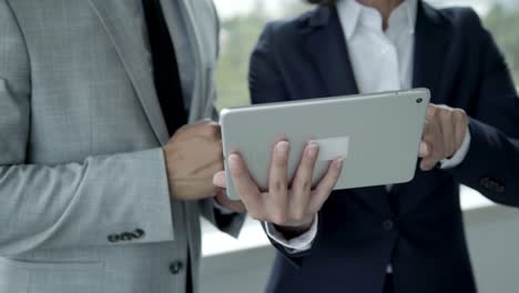 closeup shot of business people using tablet