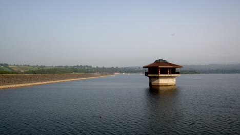 Carsington-Water-with-the-Water-Valve-Tower,-Draw-Off-Tower-and-the-dam-to-the-left