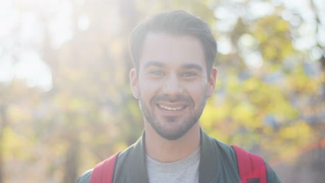 close-up view of young caucasian man with backpack looking aside