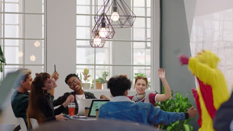 happy coworkers celebrating in the office