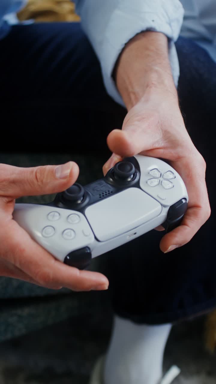 Person Holding a PlayStation 5 DualSense Controller