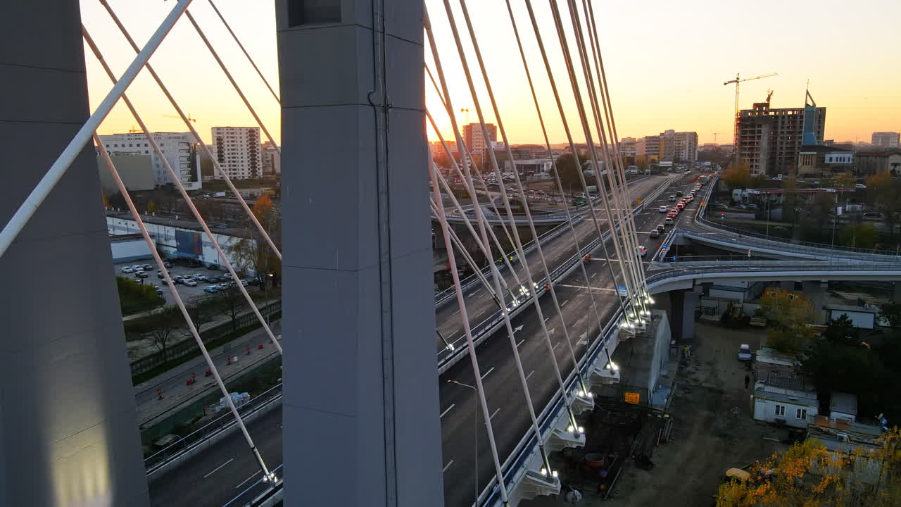 Ciurel passage, bridge over a river with moving cars. Residential buildings on the background. View from the drone. Bucharest, Romania