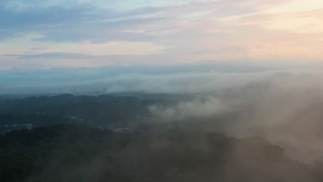 foggy mornings in mountain forests of north carolina at sunrise, aerial rising shot