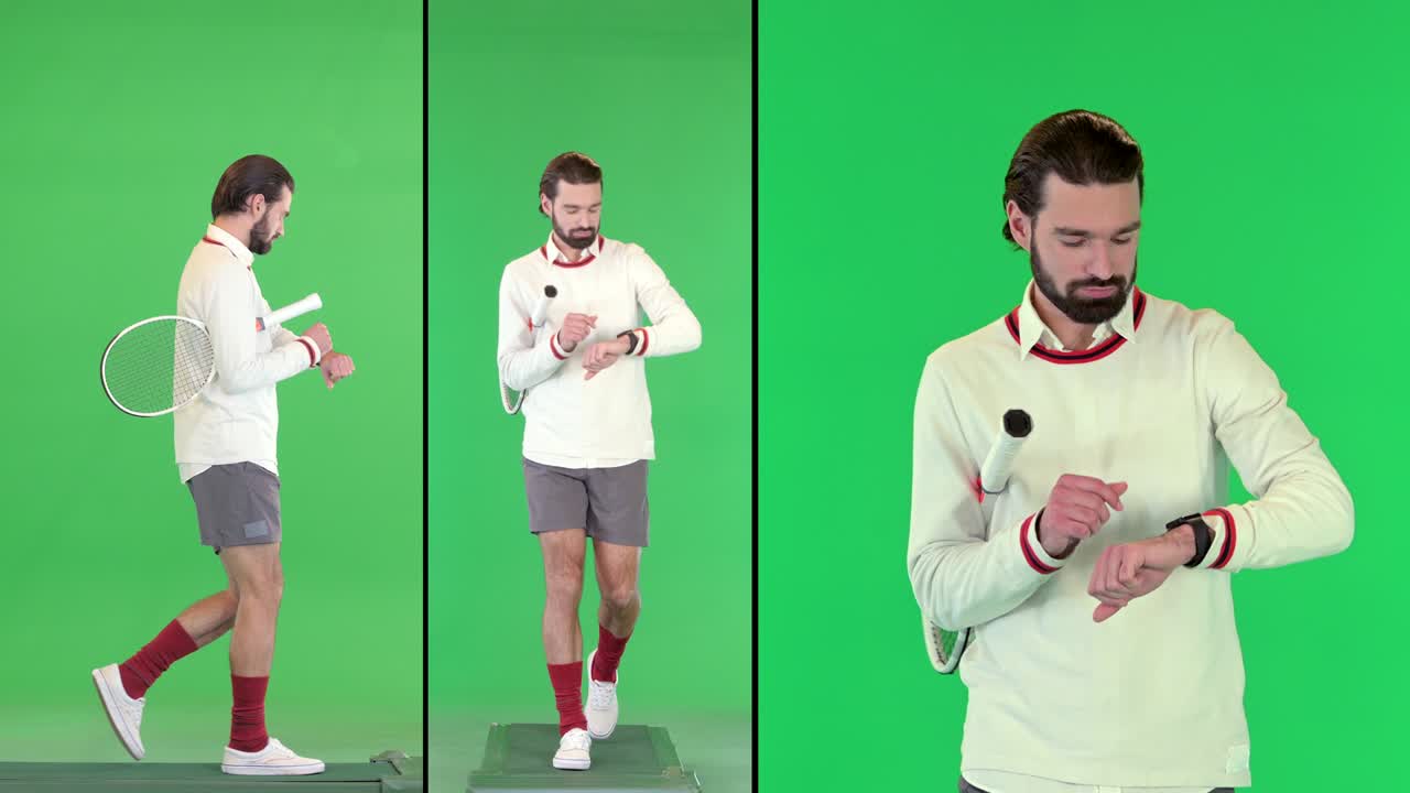 초록색 스크린, 크로마 키를 는 동안 스마트 시계를 사용하는 잘생긴 남성 테니스 선수
