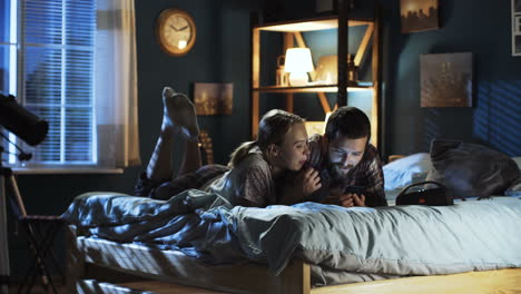 couple relaxing in bed at night
