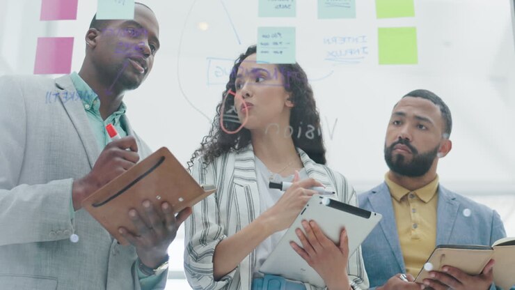 Training, brainstorming or team writing on glass