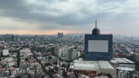 aerial view of mexico city skyline at sunset