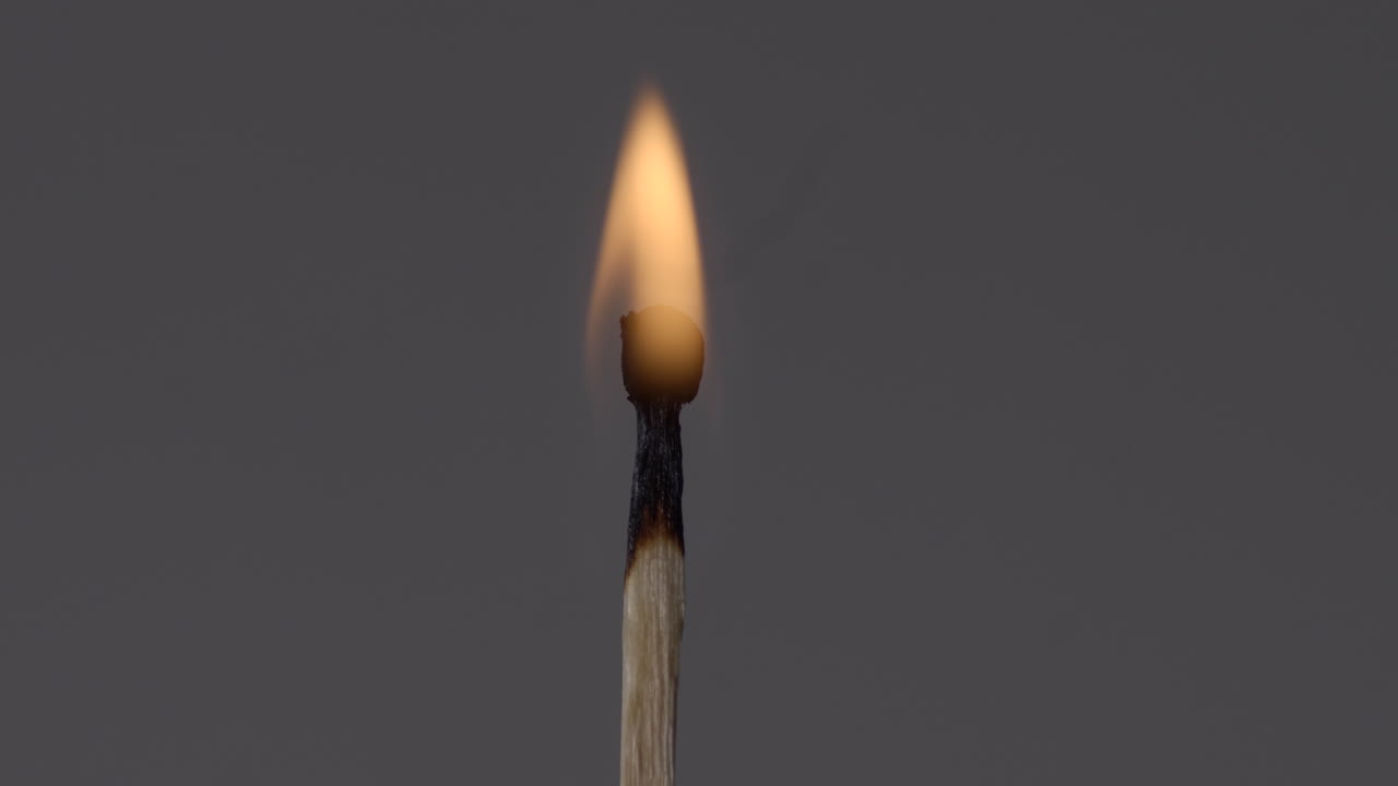 A Matching Stick With Fire Slowly Burning Until It Dies. -close up shot