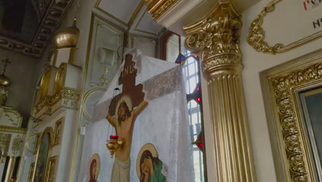 a view of jesus on the cross and his mother and a lady there in the church