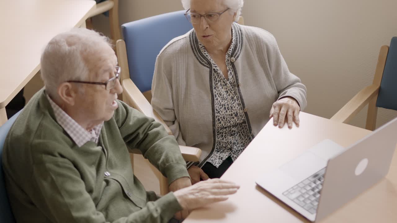 Senior people using laptop during a video call from geriatric