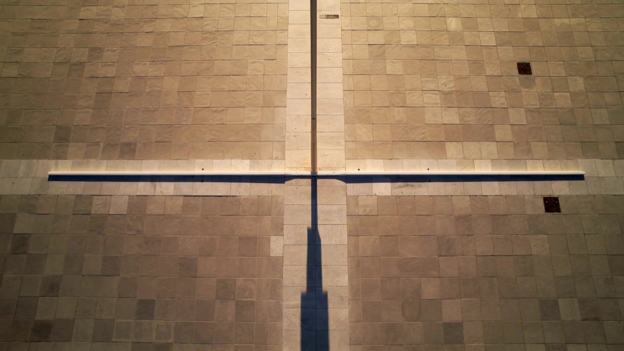 Throwing ledge and vertical strip casting shadow across roof tiles as sun moving, showing vents