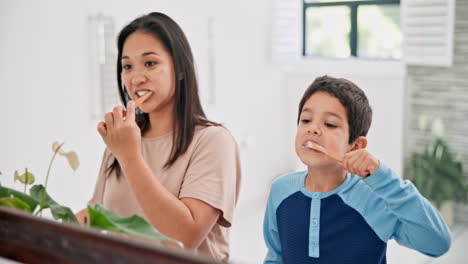 mother and child brushing teeth