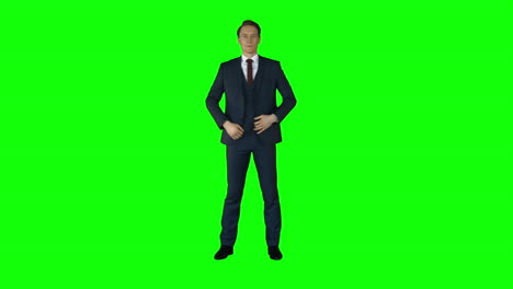 Businessman-looking-at-camera-on-green-screen-