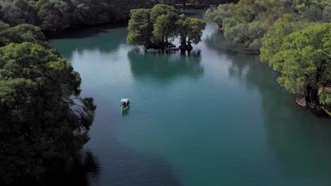 AERIAL:-Lago-De-Camecuaro,-Boat,-Tangancicuaro,-Mexico