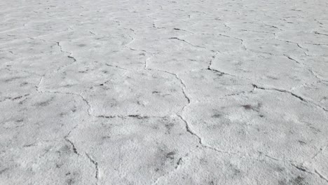 aerial close up drone shot of the argentinian white salt flats