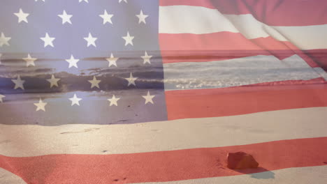 animation of american flag over sea and sunny sand beach with rock