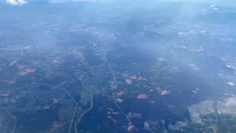 beautiful aerial view seen through window of flying airplane