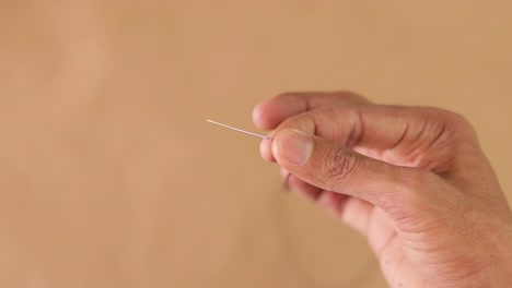 thread a beading needle. handmade crafts