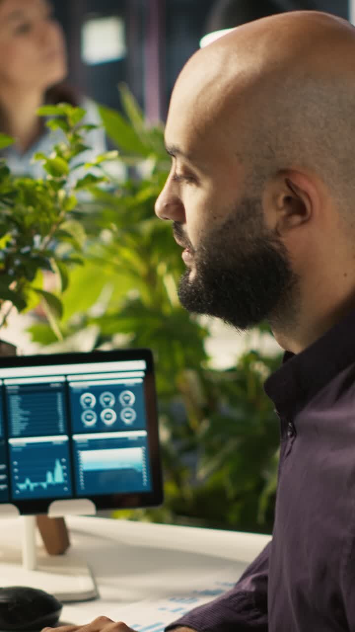 Vertical video Accountant in office giving report files to coworkers