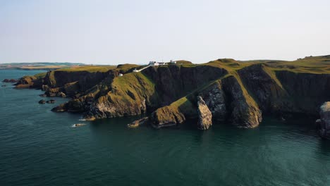 united kingdom from above: the rugged coastline and cliffs of scotland revealed over seabird nature reserve and st abbs lighthouse