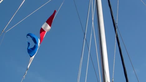 dive flags on ship mast