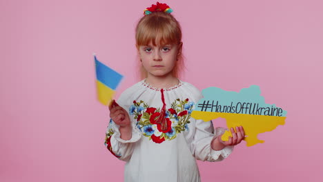 upset toddler ukrainian girl protesting war conflict raises inscription massage hands off ukraine