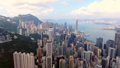 hong kong skyline and skyscrapers overlooking victoria bay on a beautiful day