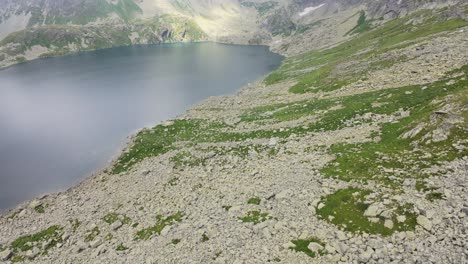 fpv drone video footage mountain lake in the slovakian high tatras during overcast conditions