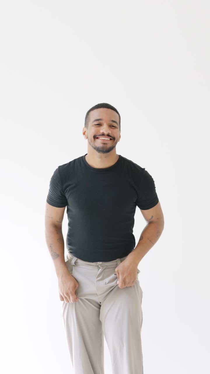 Man in Black T-Shirt and Khaki Pants