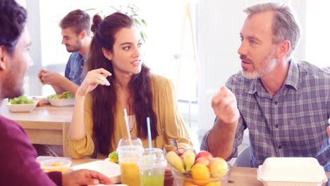 Business-colleagues-having-meal-in-cafeteria