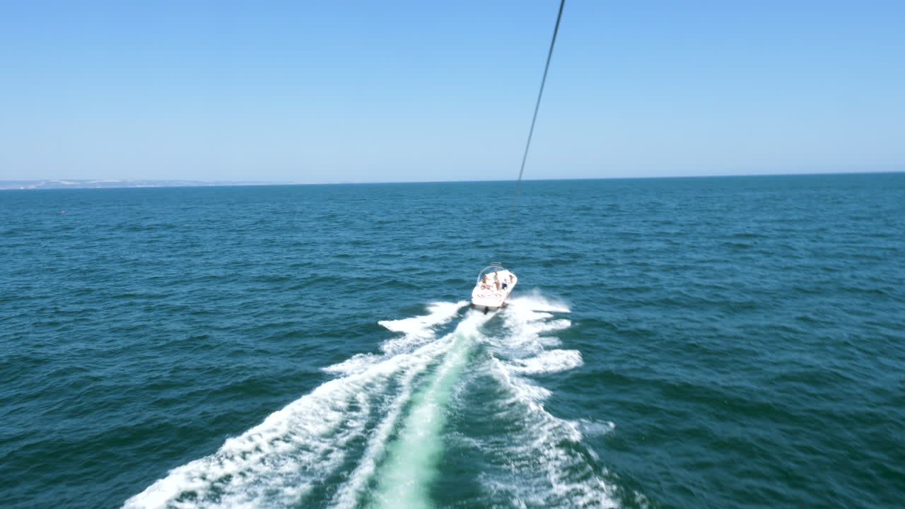 POV parasailing over the sea