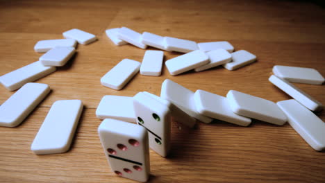 the domino effect on wooden table high angle shot