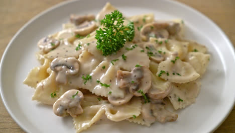 farfalle pasta with mushroom white cream sauce - italian food style