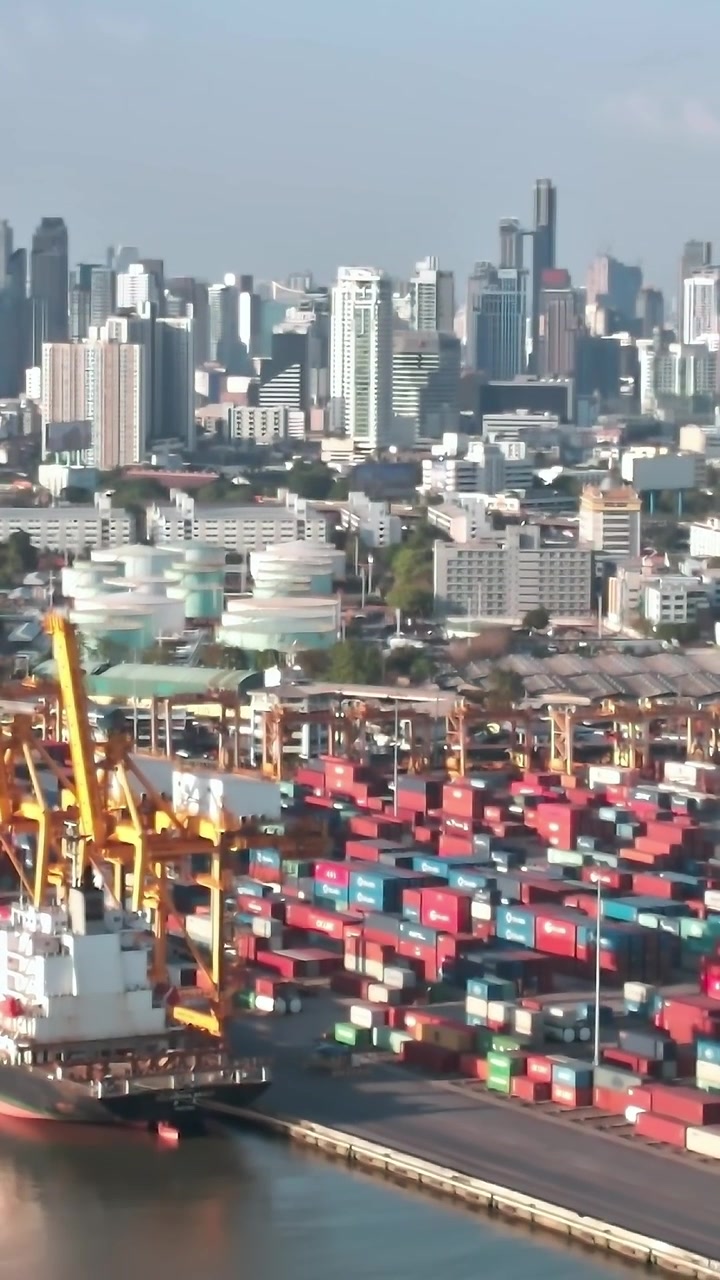 Containers and city skyline in Bangkok during daylight