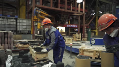 metal foundry workers in action