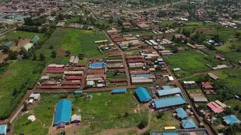 flying over the residential areas in rural town in kilimanjaro, kenya - aerial drone shot